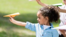 girl-flying-paper-plane