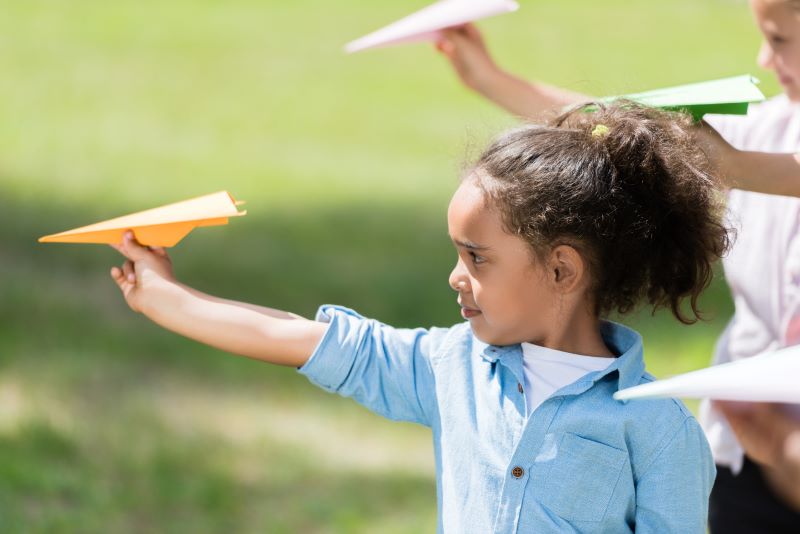 girl-flying-paper-plane